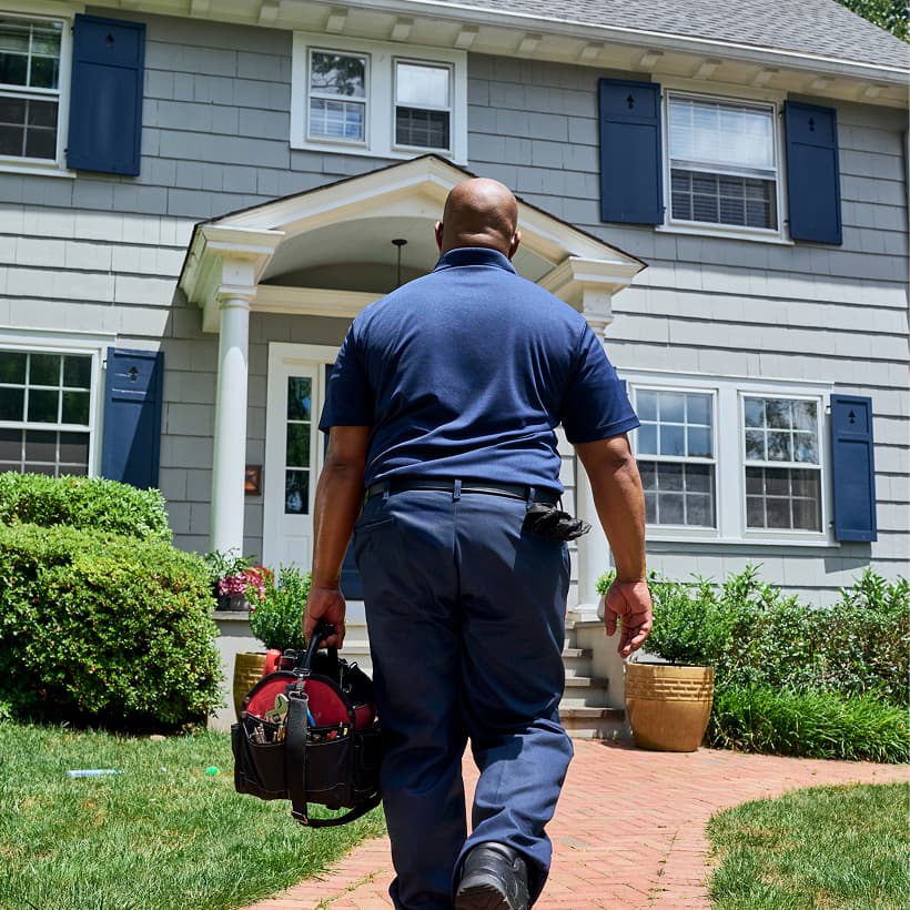 A Weeks technician arrives at a home ready to provide expert HVAC, plumbing, and electrical services.