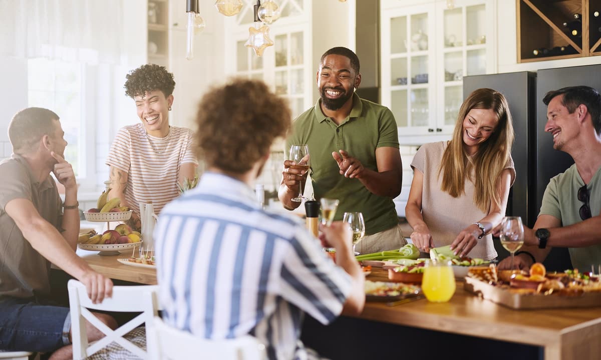 Group having a party around the kitchen table.