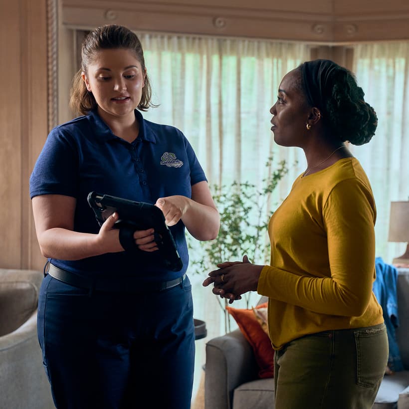 A Sansone Comfort Advisor discuss our Comfort360 Membership benefits with a homeowner.