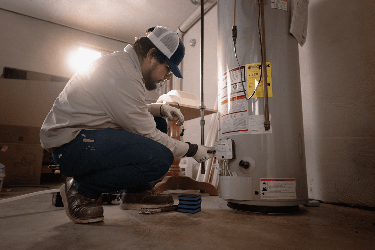 A Sansone technician discusses the repair and installation services with a homeowner.